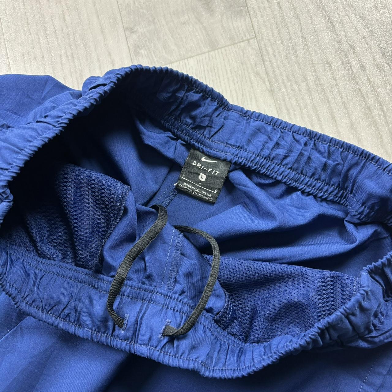 NIKE DRI FIT BAGGY TRACKSUIT BOTTOMS BLUE
