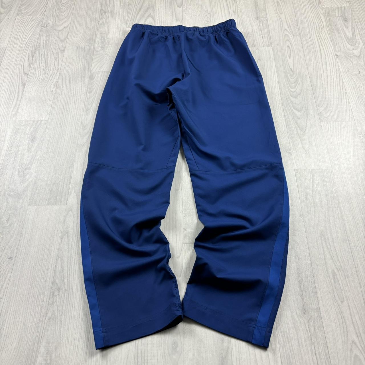 NIKE DRI FIT BAGGY TRACKSUIT BOTTOMS BLUE