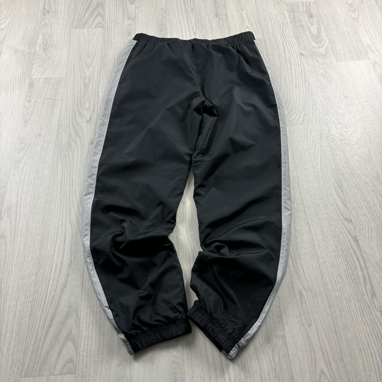 UNDER ARMOUR BAGGY TRACKSUIT BOTTOMS BLACK