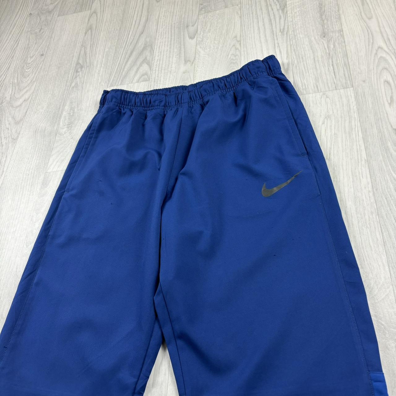 NIKE DRI FIT BAGGY TRACKSUIT BOTTOMS BLUE