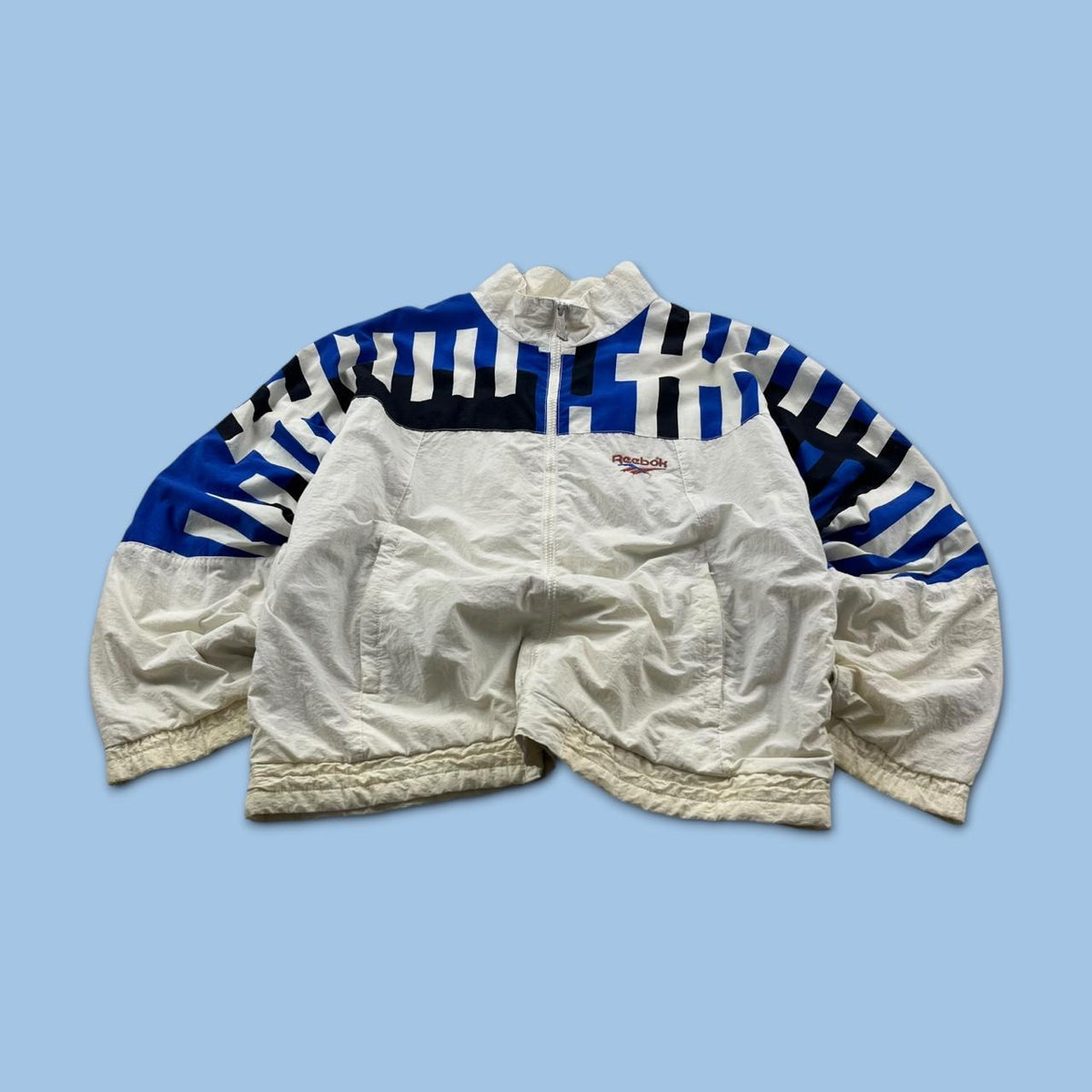 VINTAGE 90s REEBOK LIGHTWEIGHT WINDBREAKER JACKET CREAM / BLUE