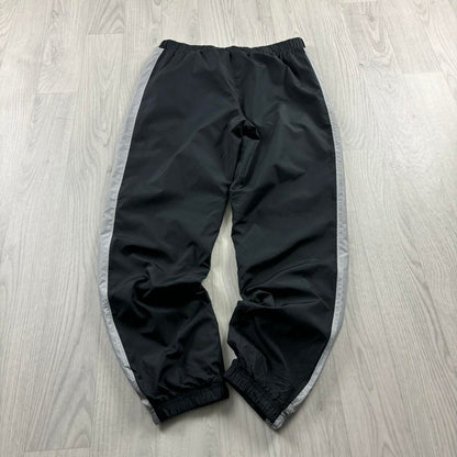 UNDER ARMOUR BAGGY TRACKSUIT BOTTOMS BLACK