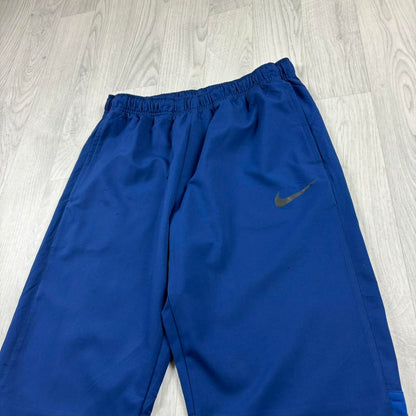 NIKE DRI FIT BAGGY TRACKSUIT BOTTOMS BLUE