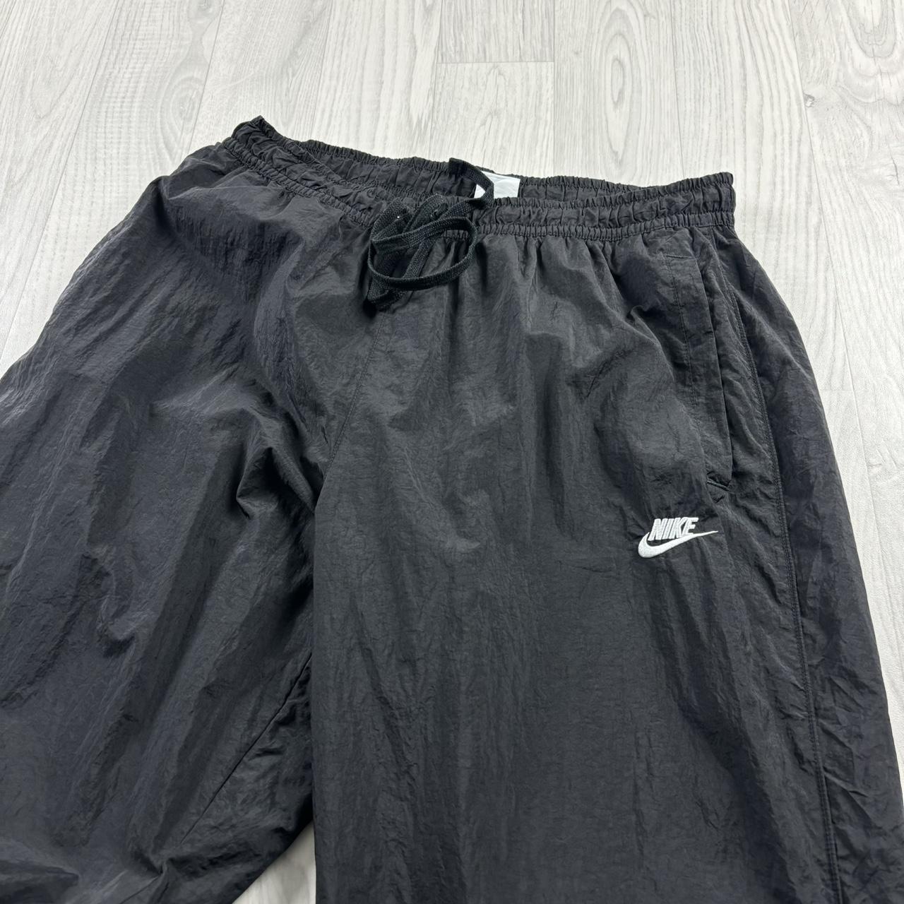 NIKE BAGGY TRACKSUIT BOTTOMS BLACK