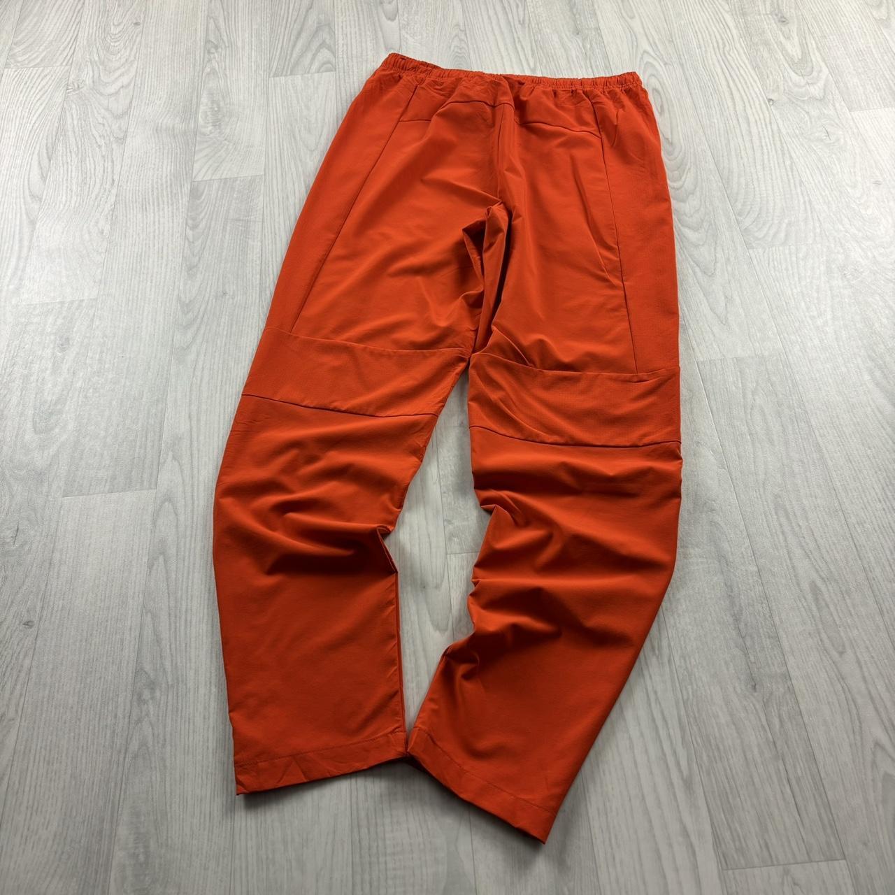 NIKE TEAM BAGGY TRACKSUIT BOTTOMS ORANGE