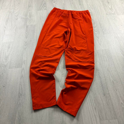 NIKE TEAM BAGGY TRACKSUIT BOTTOMS ORANGE