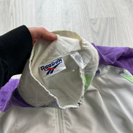 VINTAGE 90s REEBOK GEOMETRIC GRAPHIC WINDBREAKER JACKET WHITE / PURPLE
